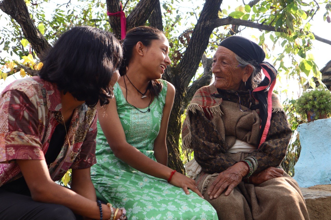 Three women in conversation — Bir, Himachal Pradesh